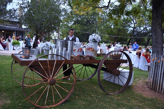 "Tables Along Drive & Near Fire Pit Beyond Wagon"